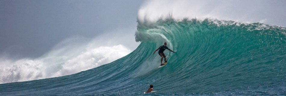 big wave with a surfer