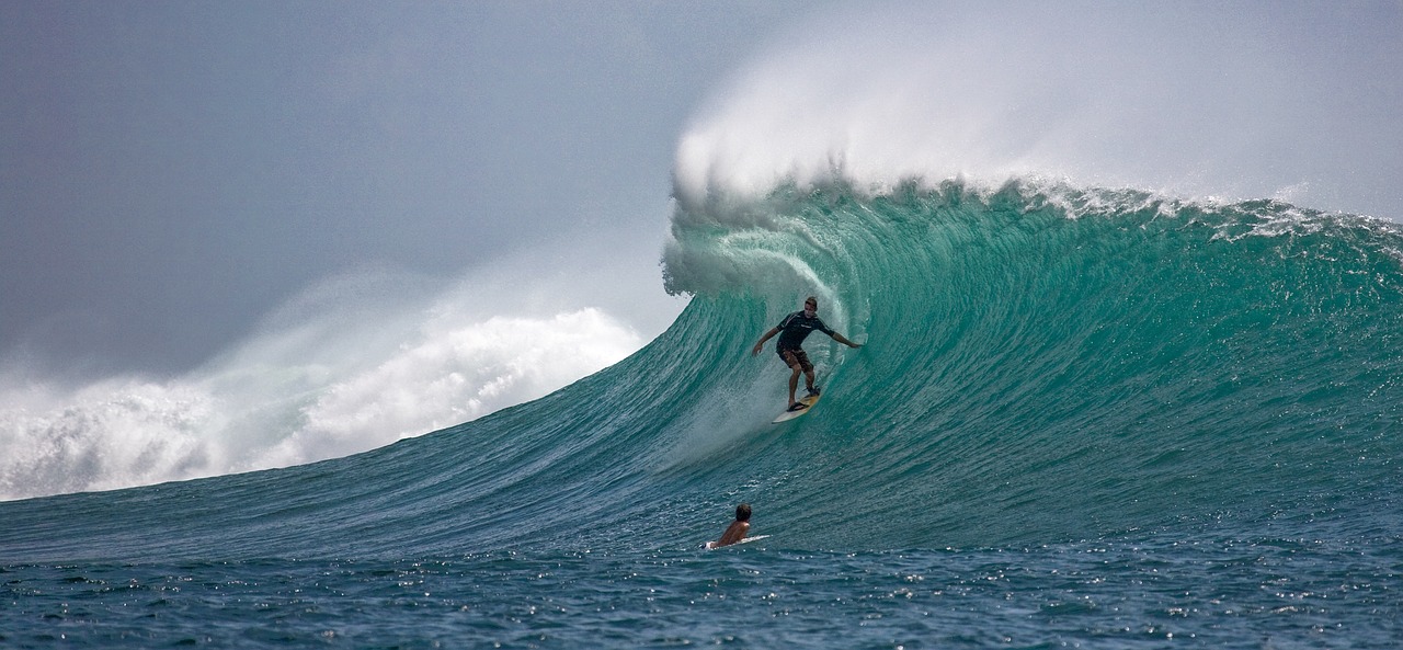 big wave with a surfer